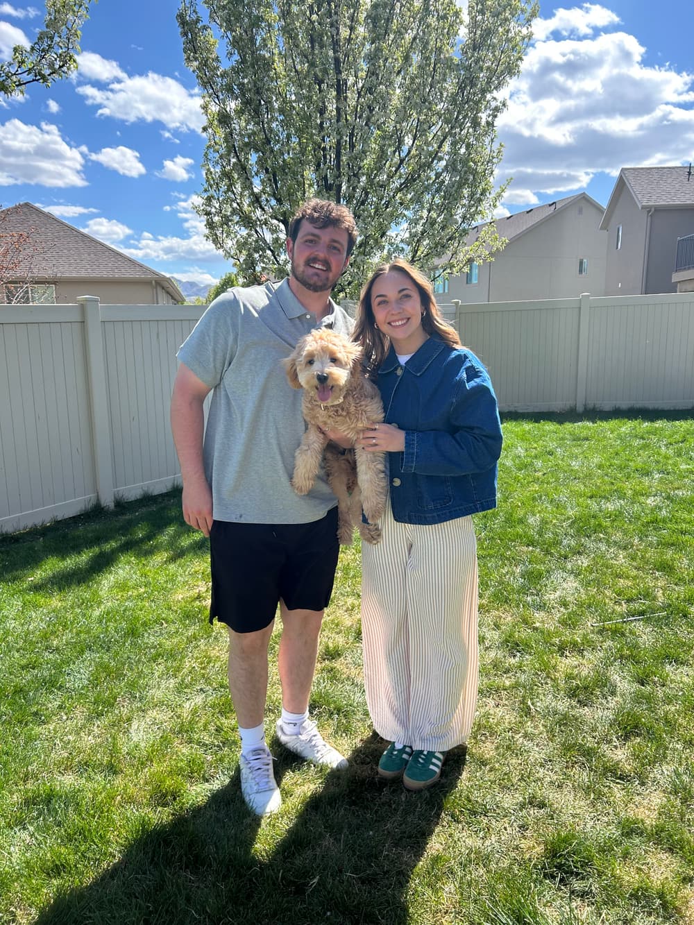 The owners of Koda Water Softener Salt outside their home in Herriman, holding Koda